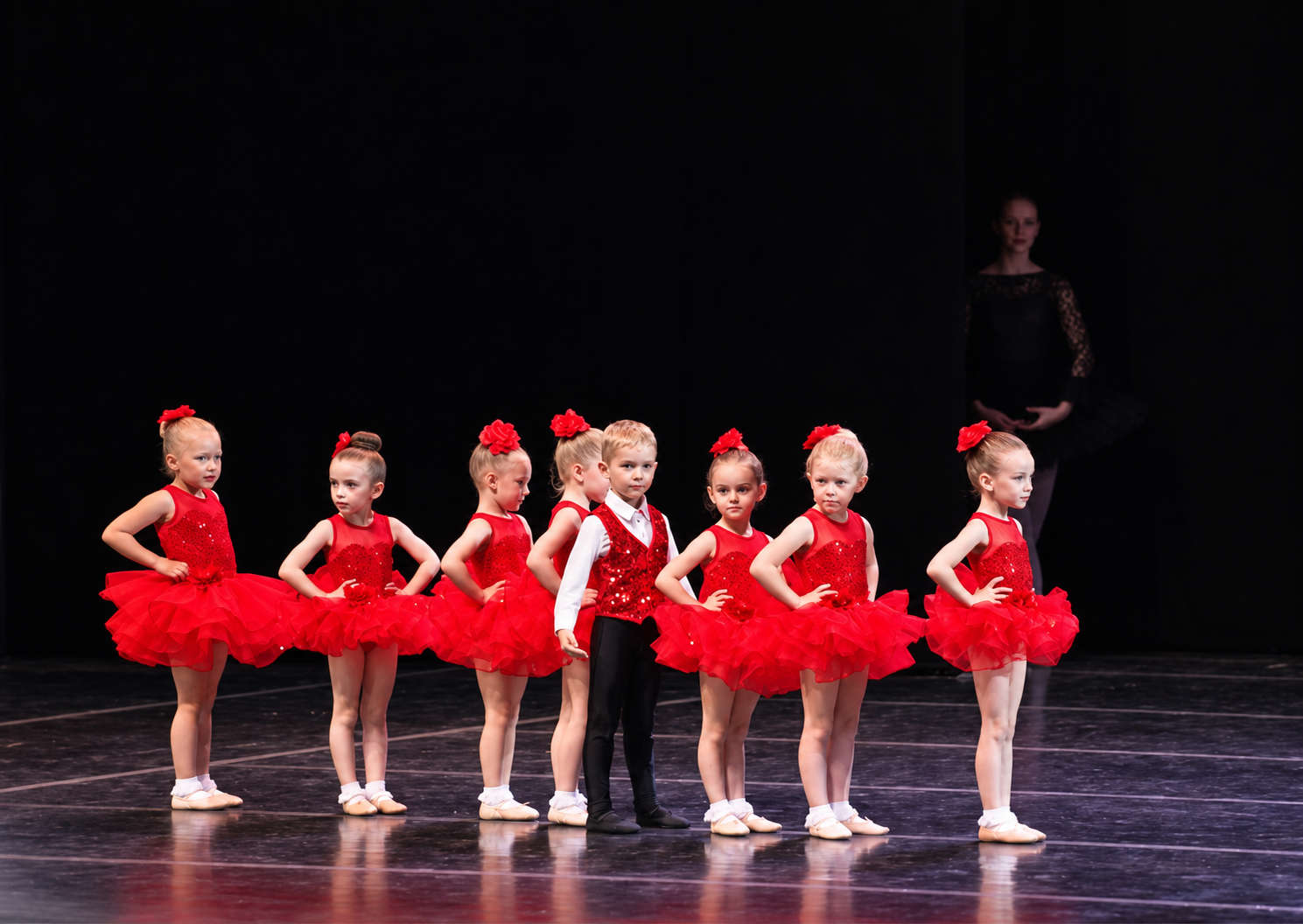 Young CRYB dancers performing in red costumes