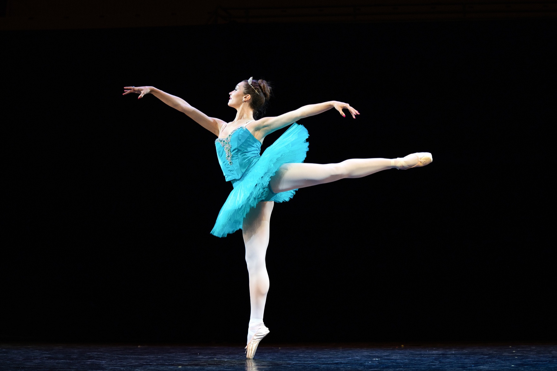CRYB ballerina performing in a blue classical tutu